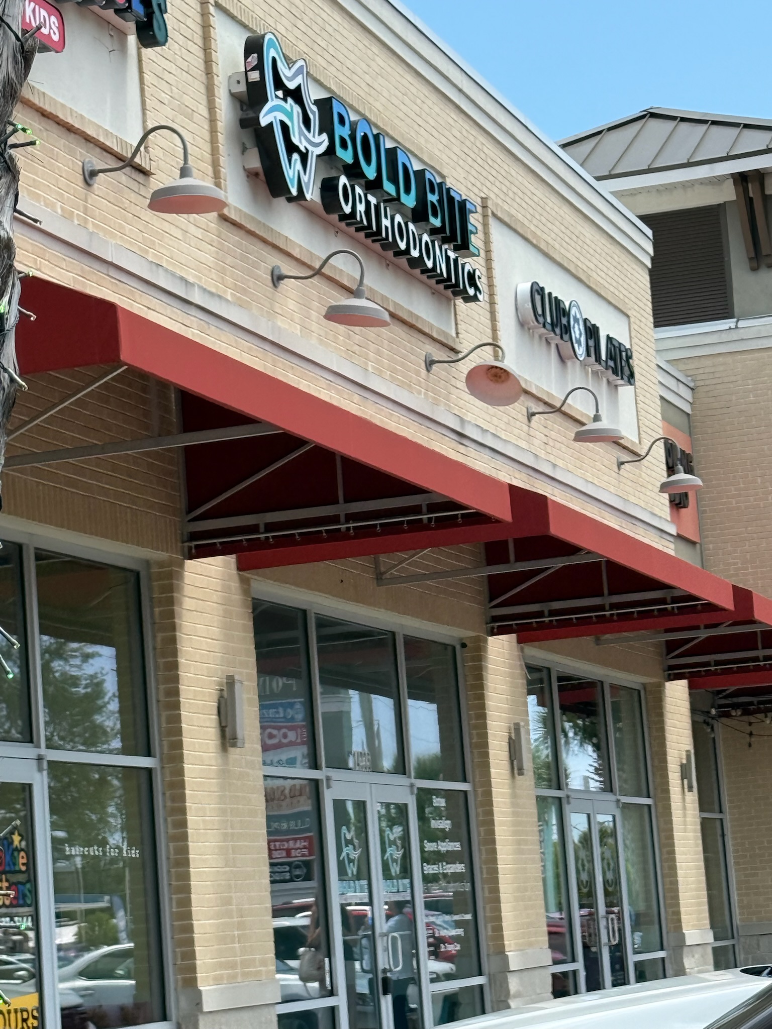Bold Bite Orthodontics exterior building with signage, daytime natural light.